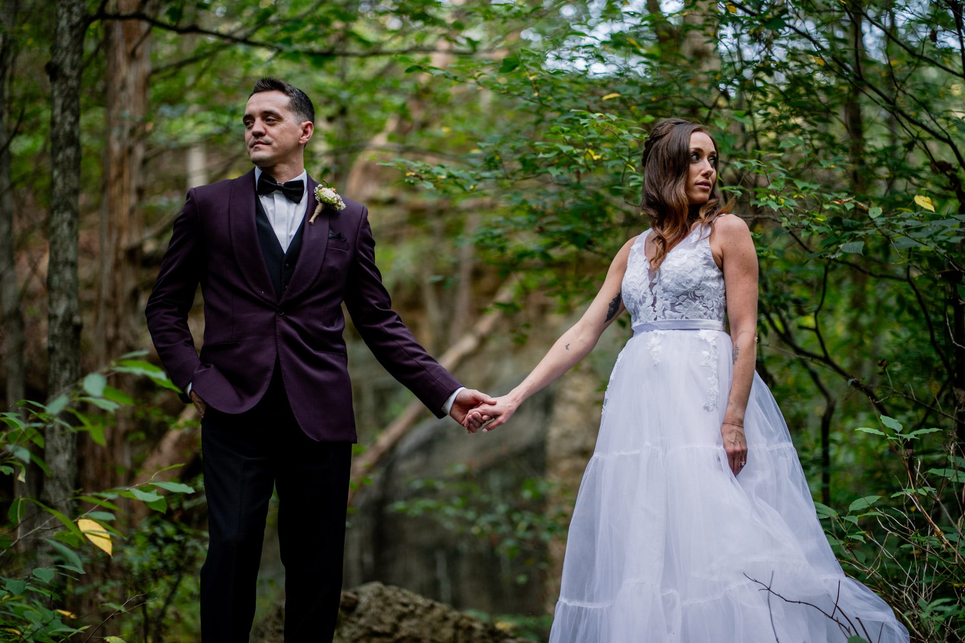 forest wedding couple holding hands