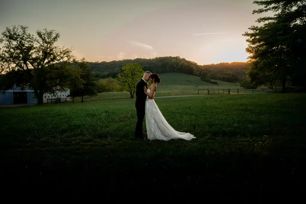 sunset couple embrace wedding