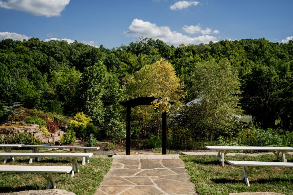 outdoor wedding ceremony setup with sunflowers Sunflower Hill Farm